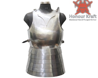 May include: A silver metal breastplate with a pointed neckline and a layered skirt. The breastplate is displayed on a mannequin. The text "Honour Kraft" is visible in the upper right corner of the image. The text "Medieval+Hand+Forged+Armor" is visible below the text "Honour Kraft". The text "Copyright o (Honour Kraft) All Right Reserved for Hind Enterprises India" is visible at the bottom of the image.