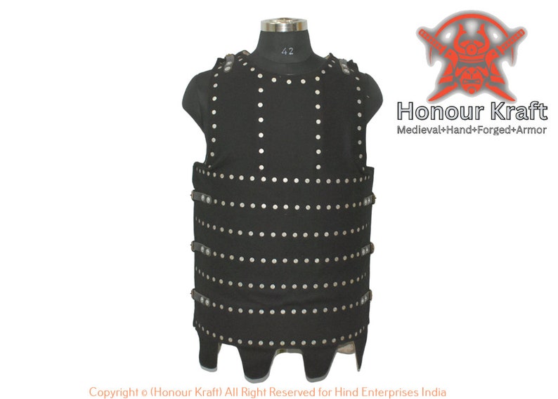 May include: A black leather armor vest with silver rivets. The vest has a pointed bottom and is worn on a mannequin. The text "Honour Kraft" and "Medieval+Hand+Forged+Armor" is visible in the image.