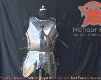 May include: A silver-colored, full-plate, medieval-style breastplate with a decorative design. The breastplate is on a mannequin and has straps and buckles. The text "Honour Kraft" is visible in the image.