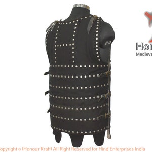 May include: A black leather vest with metal rivets and straps. The vest is designed to look like medieval armor. The text "Honour Kraft Medieval+Hand+Forged+Armor" is visible in the image.