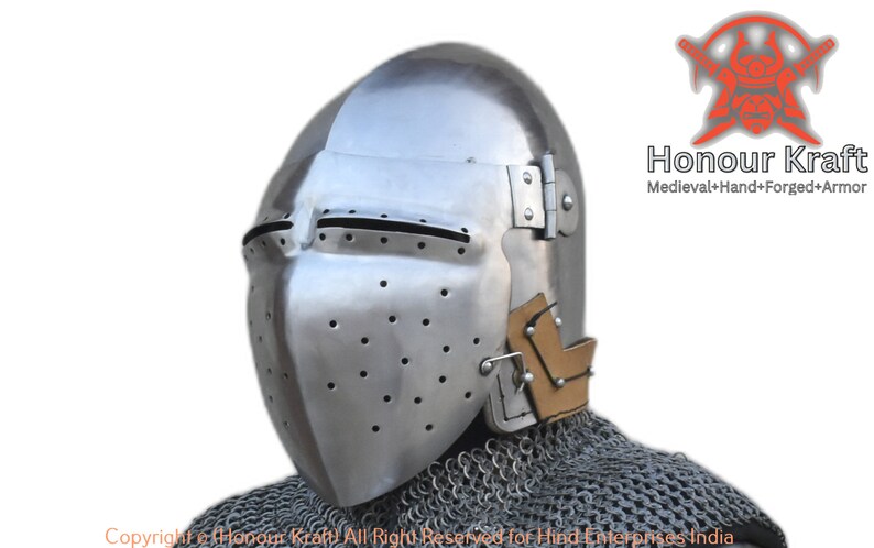 May include: A medieval helmet with a visor and a chainmail coif. The helmet is made of steel and has a brown leather lining. The helmet is hand-forged and has a textured surface.