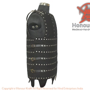 May include: Black leather armor vest with metal rivets and straps. The vest has a pointed bottom and is designed to protect the torso.  Honour Kraft Medieval Hand-Forged Armor. Copyright o (Honour Kraft) All Right Reserved for Hind Enterprises India
