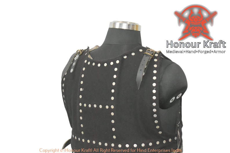 May include: Black leather armor with silver rivets and straps. The armor is displayed on a mannequin. The text "Honour Kraft Medieval+Hand+Forged+Armor" is visible in the upper right corner of the image. The text "Copyright Honour Kraft) All Right Reserved for Hind Enterprises India" is visible at the bottom of the image.