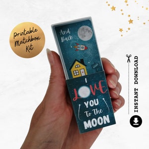 May include: Printable matchbox kit with a blue and white design featuring a rocket ship, a house, a moon, and the text "I love you to the moon and back".
