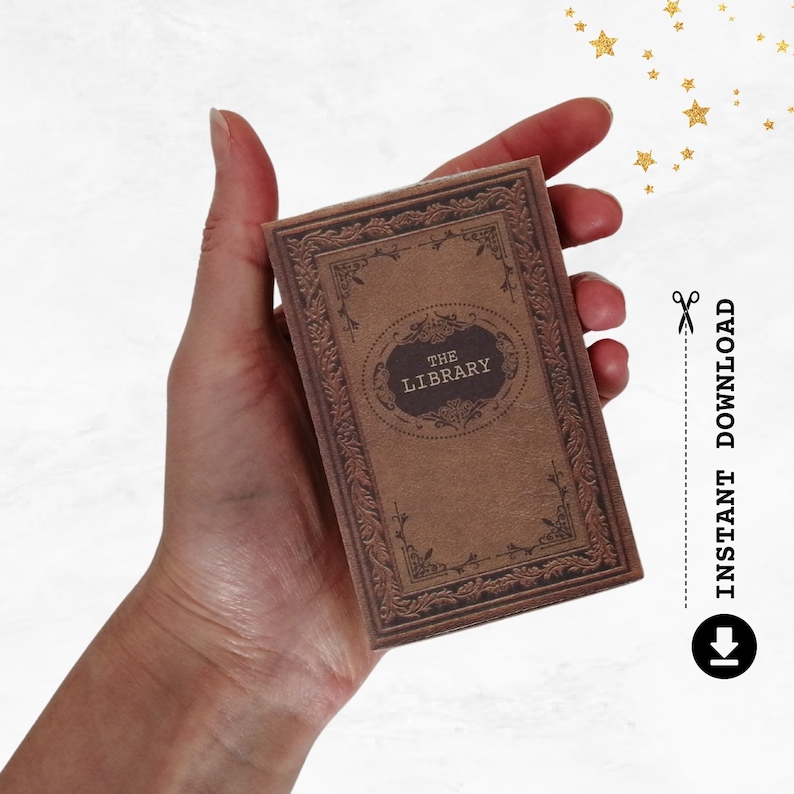 May include: A brown book with a decorative border and the text "THE LIBRARY" on the cover.