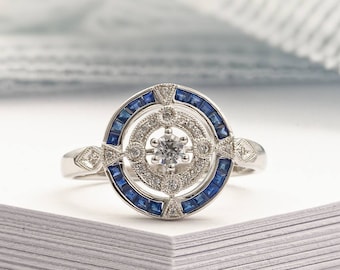 Antique Art Deco inspired white gold ring with diamond and blue sapphier halo