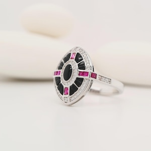 Onyx, ruby and diamond shield target ring in white gold