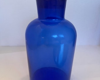 Cobalt blue glass Apothecary jars with glass stopper lids. Vintage ware.