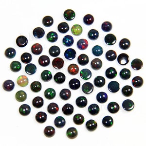 May include: A collection of 50 round black opal cabochons, each with a different iridescent color display. The opals are approximately 6mm in diameter and have a smooth, polished finish.