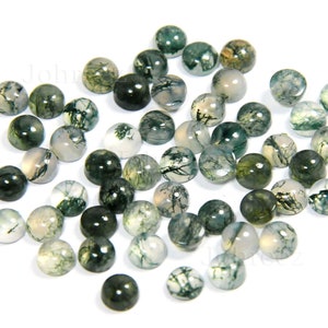 May include: A collection of green moss agate cabochons, each with a unique pattern of green and white dendrites. The cabochons are smooth and polished, and they are perfect for jewelry making.
