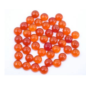 May include: A collection of 30 round, orange carnelian cabochons. The cabochons are smooth and polished, with a slight variation in color.