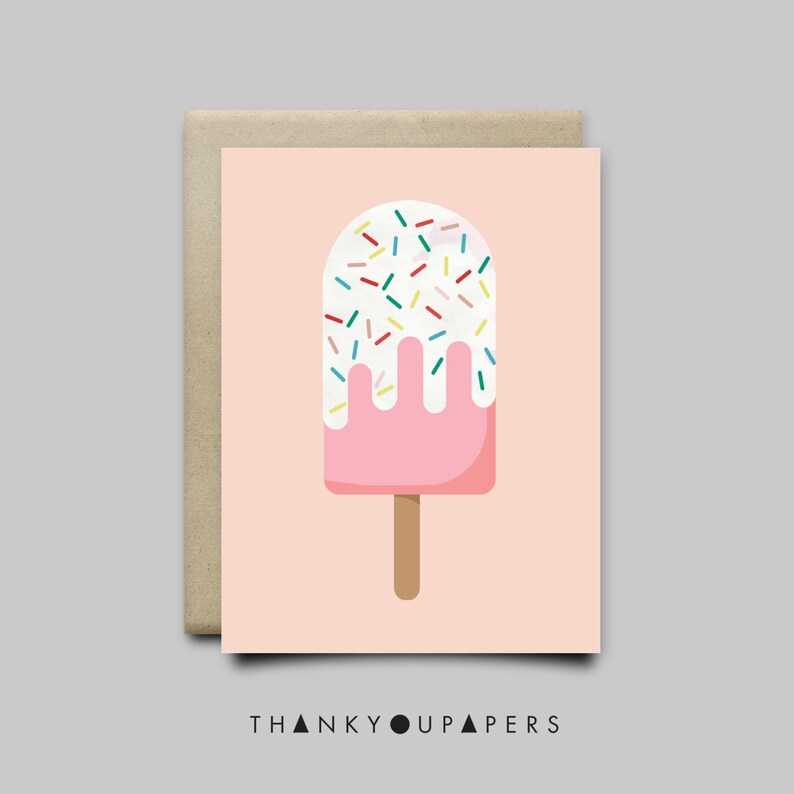May include: A pink popsicle with white frosting and colorful sprinkles on a light pink background. The popsicle has a brown stick.