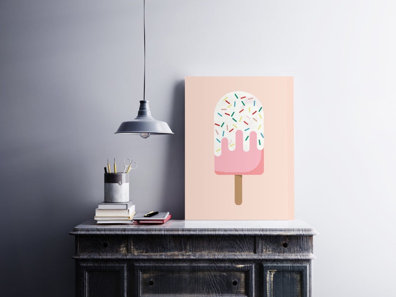 May include: A pink and white popsicle with colorful sprinkles on a light pink background.