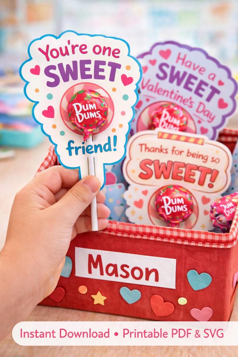 May include: A Valentine's Day gift basket with a red gingham-lined box, decorated with hearts and stars. The box holds lollipop cards that say "You're one SWEET friend!" and "Have a SWEET Valentine's Day."