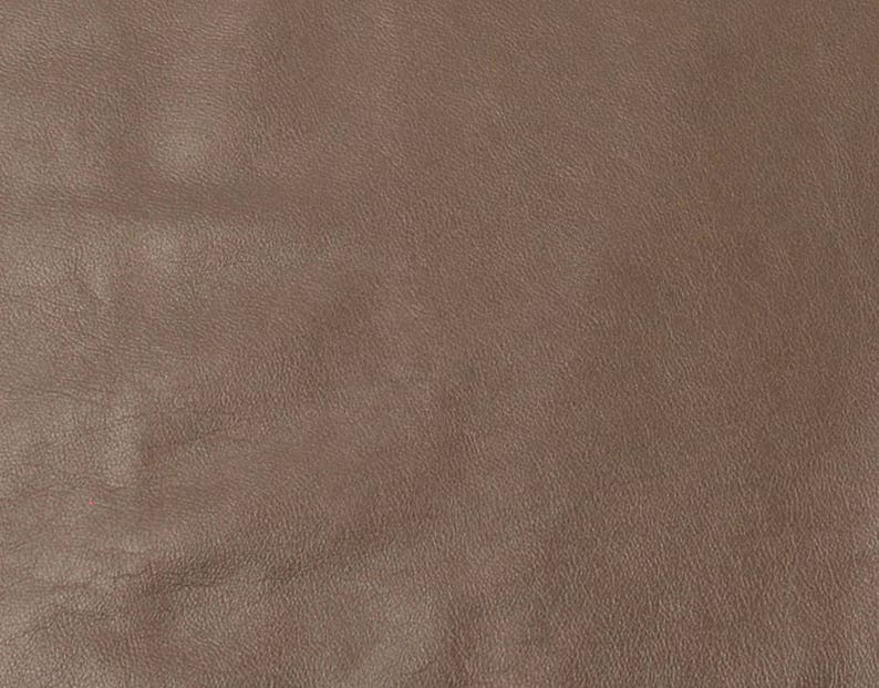 Piece of golden cowhide leather grained leather