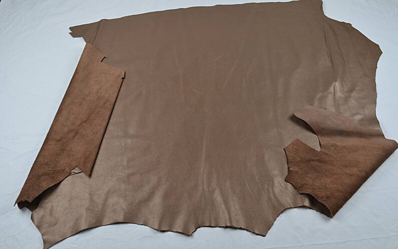 Piece of golden cowhide leather grained leather