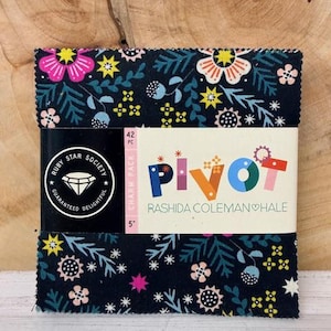 May include: A bundle of 42 fabric charm squares featuring a floral design in pink, yellow, and white on a navy blue backdrop. The package is labelled "Pivot" by Rashida Coleman Hale and "Ruby Star Society". Each square measures 12.7 cm.