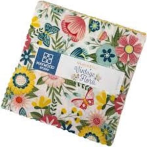May include: A square fabric bundle featuring a floral pattern with yellow, pink, and blue flowers, and butterflies on a white background. The bundle includes a label that reads "Vintage Flora" and "Maywood Studio".