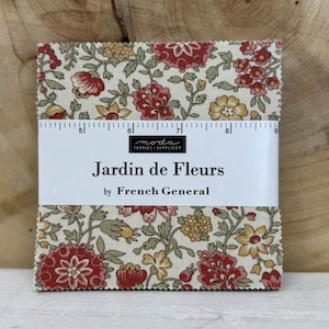 May include: A fabric bundle with a floral design in red, yellow, and green on a cream backdrop. The fabric is labelled "Jardin de Fleurs" by French General, with a ruler printed on the side. The fabric is approximately 23 cm wide.