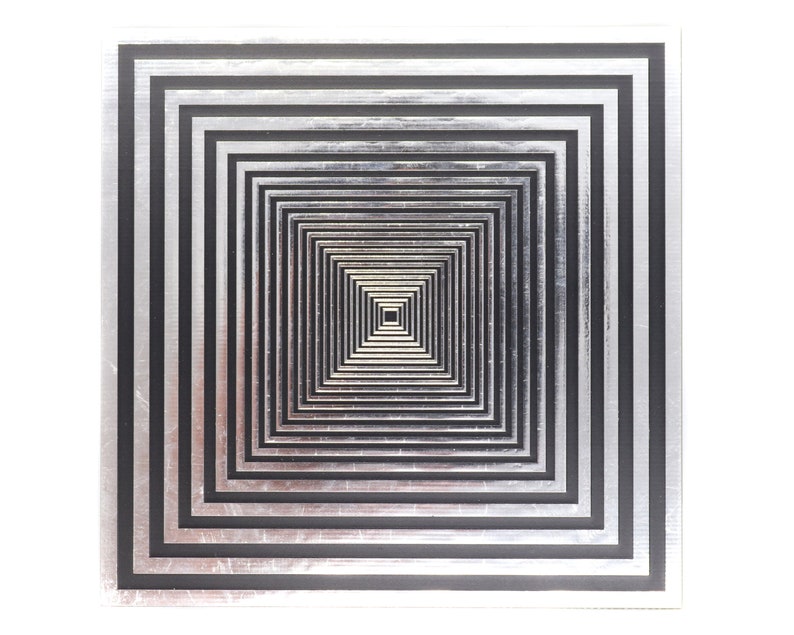 May include: A black and silver square artwork with concentric squares creating an optical illusion of depth.