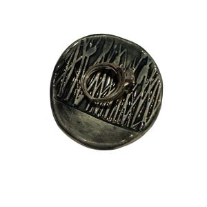 May include: A set of three ceramic mugs with a speckled, matte finish. The mugs are in shades of cream, light gray, and dark gray. Each mug has a simple, minimalist design, perfect for coffee or tea.