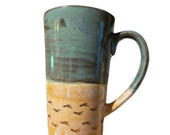 Two sets of footprints in the sand, blue green ocean tides mug, ceramic stoneware tall latte coffee cup (16oz)