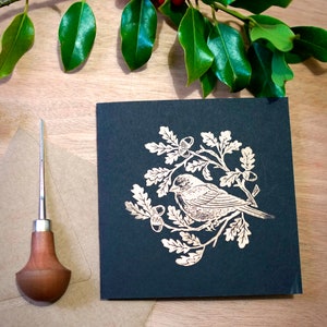 Carte de noël , linogravure oiseau or sur noir, « bird in winter 1 », valerie lenoir