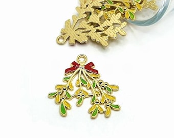 May include: Gold-tone metal charm with a red bow and green and yellow mistletoe sprigs.