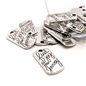May include: Silver metal tags with the phrase "Find the joy in the journey" engraved on them.