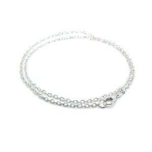 May include: A silver chain necklace with a lobster clasp closure.
