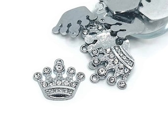 May include: Silver crown charm with clear rhinestones. The crown is a popular design for jewelry making and crafting.