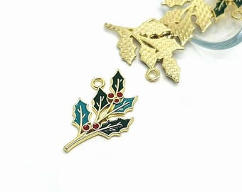 May include: Gold-tone metal holly sprig charm with green and red enamel. The charm has two jump rings for attaching to jewelry or other crafts.