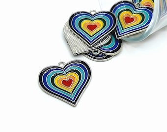May include: A collection of heart-shaped charms with a rainbow design. Each charm features a silver border and a layered pattern of red, orange, yellow, green, blue, and navy blue. The charms are suitable for jewelry making or craft projects.