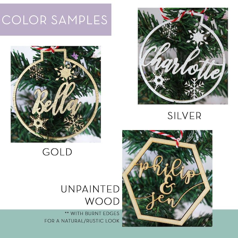 May include: A selection of personalized Christmas ornaments in gold, silver, and unpainted wood. The ornaments feature names like "Bella", "Charlotte", "Philip & Jen", and snowflake designs. The text "Color Samples" and "Unpainted Wood" are also visible.