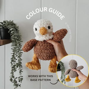 May include: A crocheted bird toy in brown, white, and yellow. The bird has a white head, a yellow beak, and brown wings and body. The image includes the text "COLOUR GUIDE" and "WORKS WITH THIS BASE PATTERN".