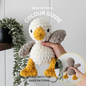 May include: A handmade crochet duck plushie with a white body, yellow beak and feet, and gray wings. The text "BEAK PATTERN + COLOUR GUIDE" is at the top, and "WORKS WITH THIS BASE PATTERN" is at the bottom. A smaller version of the duck is in the lower right.