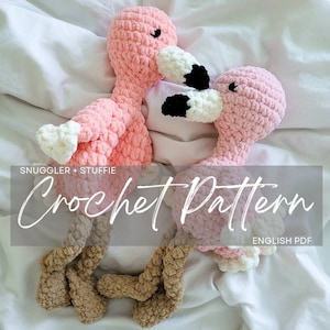 May include: Two pink crocheted flamingo plushies with brown legs, snuggled together on a white blanket. The text "Snuggler + Stuffie Crochet Pattern ENGLISH PDF" is visible at the bottom of the image.