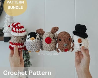 May include: A collection of five crocheted holiday-themed figures. The figures include a snowman, a reindeer, a penguin, and a figure wearing a Santa hat. The text "PATTERN BUNDLE" is in a yellow oval. The text "Crochet Pattern English PDF" is below the figures.