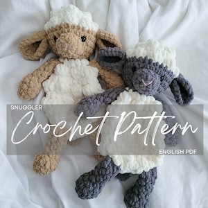 May include: Two crocheted plush lamb toys, one white and brown, the other white and gray, on a white fabric background. The text "Snuggler Crochet Pattern English PDF" is visible at the bottom of the image.