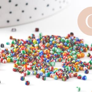 Petite Perle rocaille rayé multicolore 1.5x2mm x 10gr (G10934)