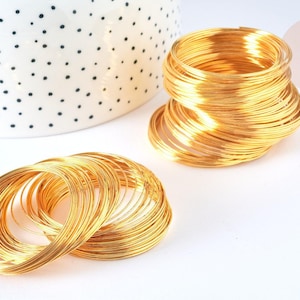 40 mm verguld stalen geheugendraad MET DEFECT, 20 windingen (G7209)