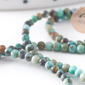 Perle Jaspe turquoise africaine naturelle 2mm,x1 fil de 39cm (G1541)