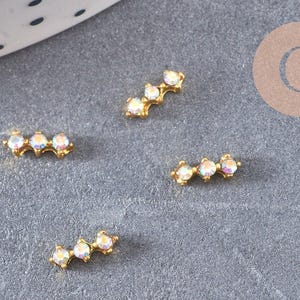 Element à coller zamac doré et zircon AB 57x2.2mm, x2 (G5252)