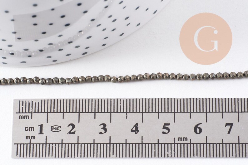 Perles rondes pyrite naturelle facettée 2mm, x1 fil de 40cm (G4046)