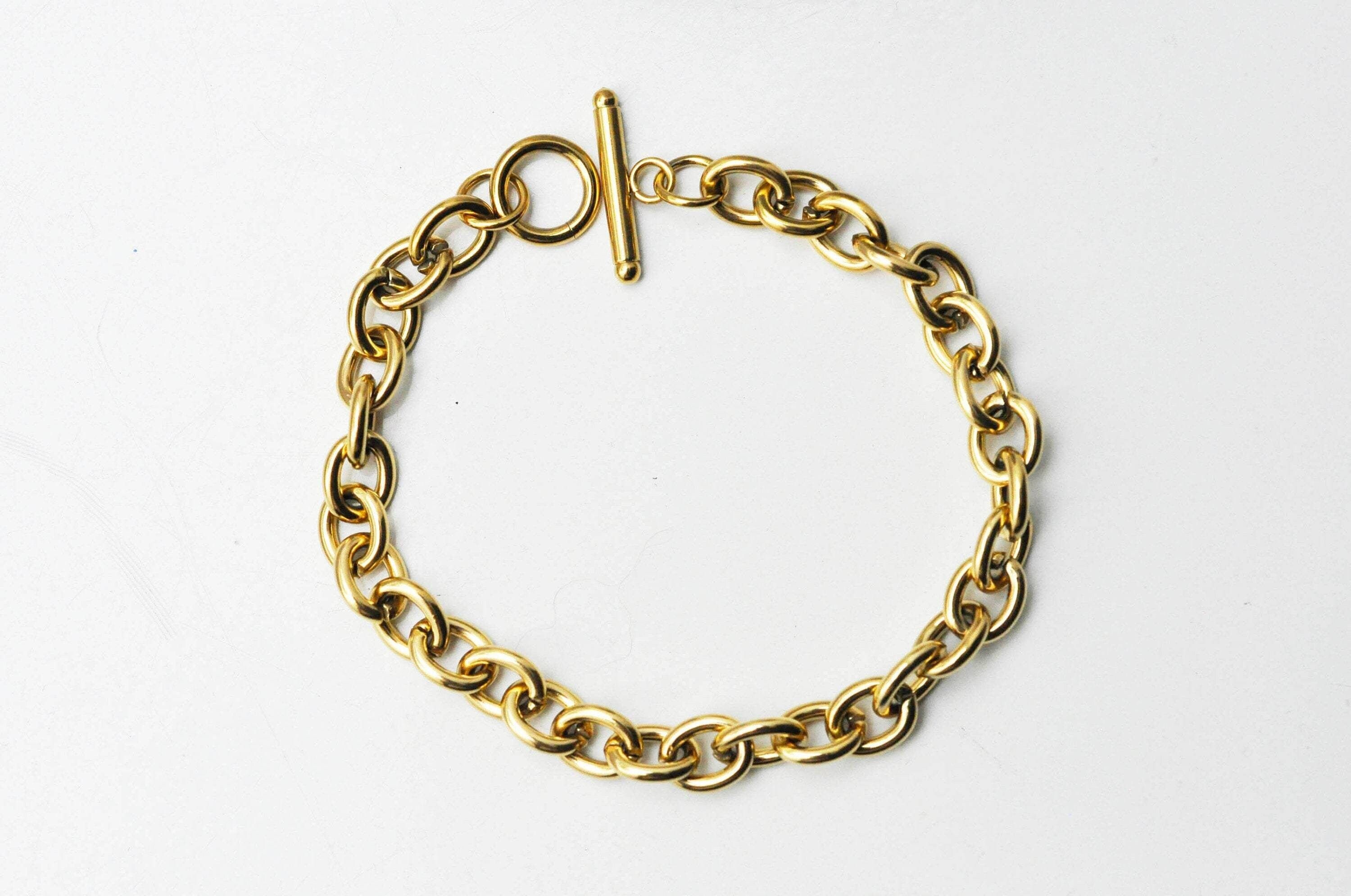Bracelet grosse maille fine dorée avec anneau