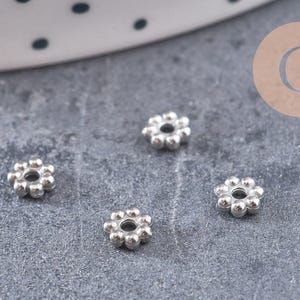 Spacer beads, flower-shaped washers, 304 stainless steel, platinum plated, 4mm, x10 (G10904)