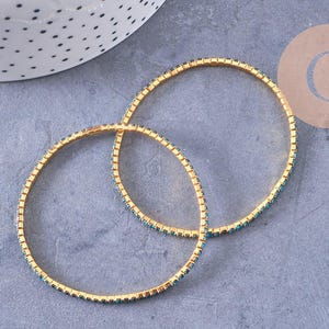 Elastic bracelet with gold-plated brass and blue rhinestones, 50mm, x1 (G3960)