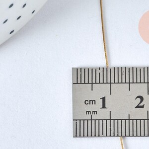 Fil câblé gainé acier inoxydable doré 0.38mm, x1 Bobine de 50 mètres (G6778)