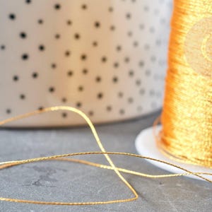 Goudkleurig metallic nylon garen 0,3 mm, 5 meter (G8491)
