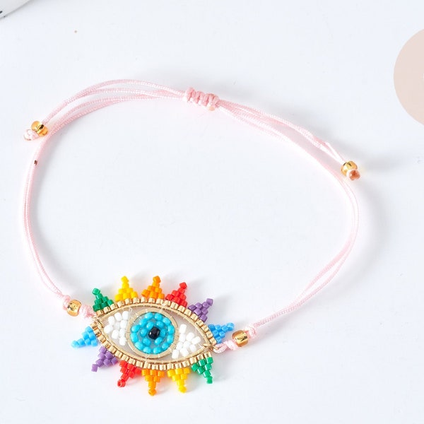 Bracelet Réglable mauvais œil multicolore 28cm cordon rose nylon perles rocailles tissées , bijou chance à offrir, bracelet amitié, l'unité